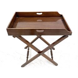 Early 19th century mahogany butler's tray on stand, the tray with pierced handles, on folding base with turned stretchers
