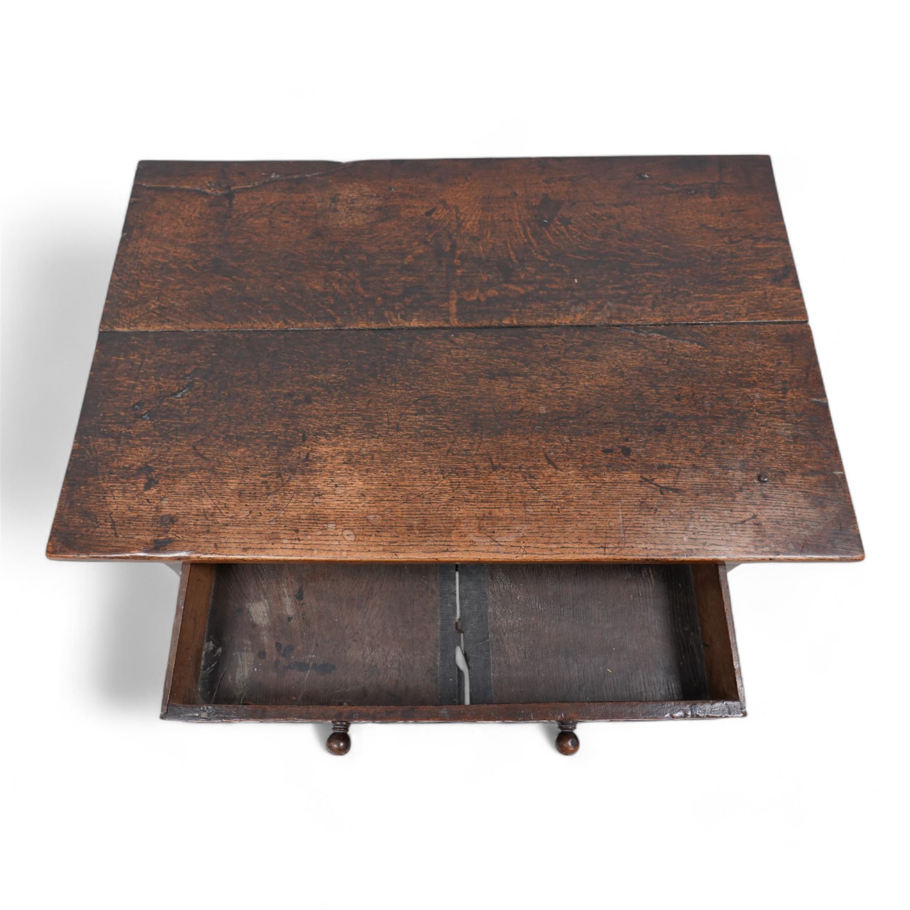 18th century oak side table, rectangular pegged two-plank top over singe drawer carved with S-scrolls, on turned supports united by plain stretchers 