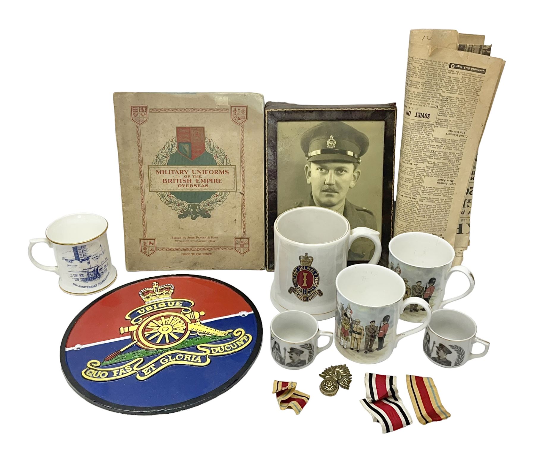 Collection on military items, including John Player & Sons Military Uniforms of the British Overseas, medal ribbon, ceramics and a reproduction metal plaque 