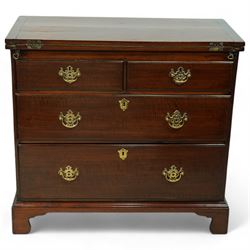 Georgian design mahogany bachelor's chest, fold-over top with inset baize lined interior supported by twin stays, fitted with two short over two long graduating drawers on bracket feet