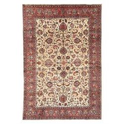 Persian Sarough ivory ground rug, the field decorated with curled leafy branches and palmettes, crimson ground border decorated with further palmettes and floral sprays, within guard stripes 