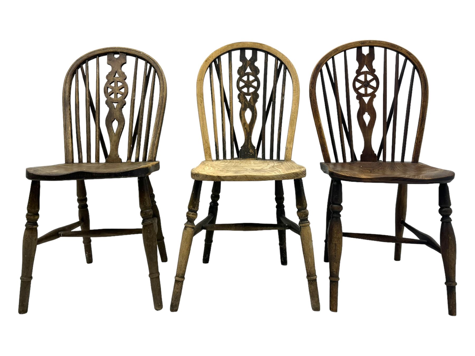 Mid-to-late 20th century set of six elm and beech Windsor dining chairs, hoop and stick back with pierced wheel splat, dished elm seat, on turned supports united by turned stretchers 