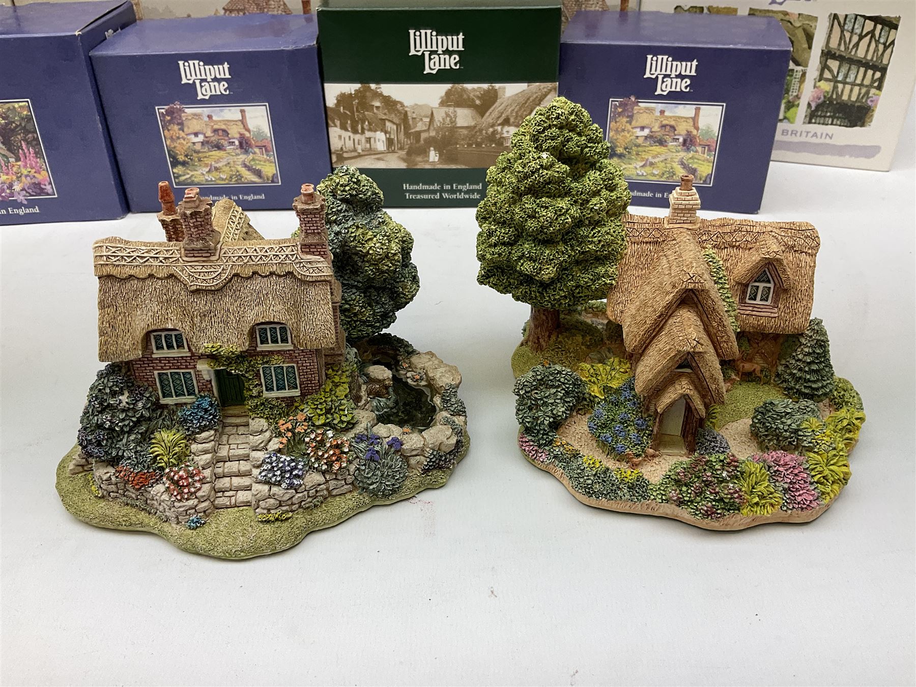 Twelve Lilliput Lane models to include The 1994 Anniversary Cottage Watermeadows, Collector's Club Woodman's Treat, Castle Hill, Huddersfield, Symbol of Membership Kiln Cottage etc, all boxed, eight with deeds