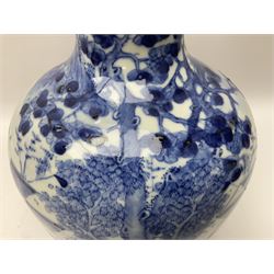 Late 18th/early 19th century Chinese blue and white bottle vase, decorated with a landscape scene containing dwellings, prunus and pine trees, boats and bridges, and populated with figures, with character mark beneath, H35cm