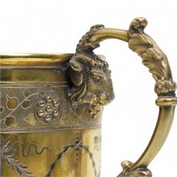 Victorian silver gilt christening mug of Gothic design engraved with trailing garlands with raised beaded flower heads and rams head handle H9cm London 1868 Maker Henry Holland in leather case