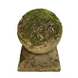 Set of three weathered cast stone gate post finials, circular orb on step-canted square base 