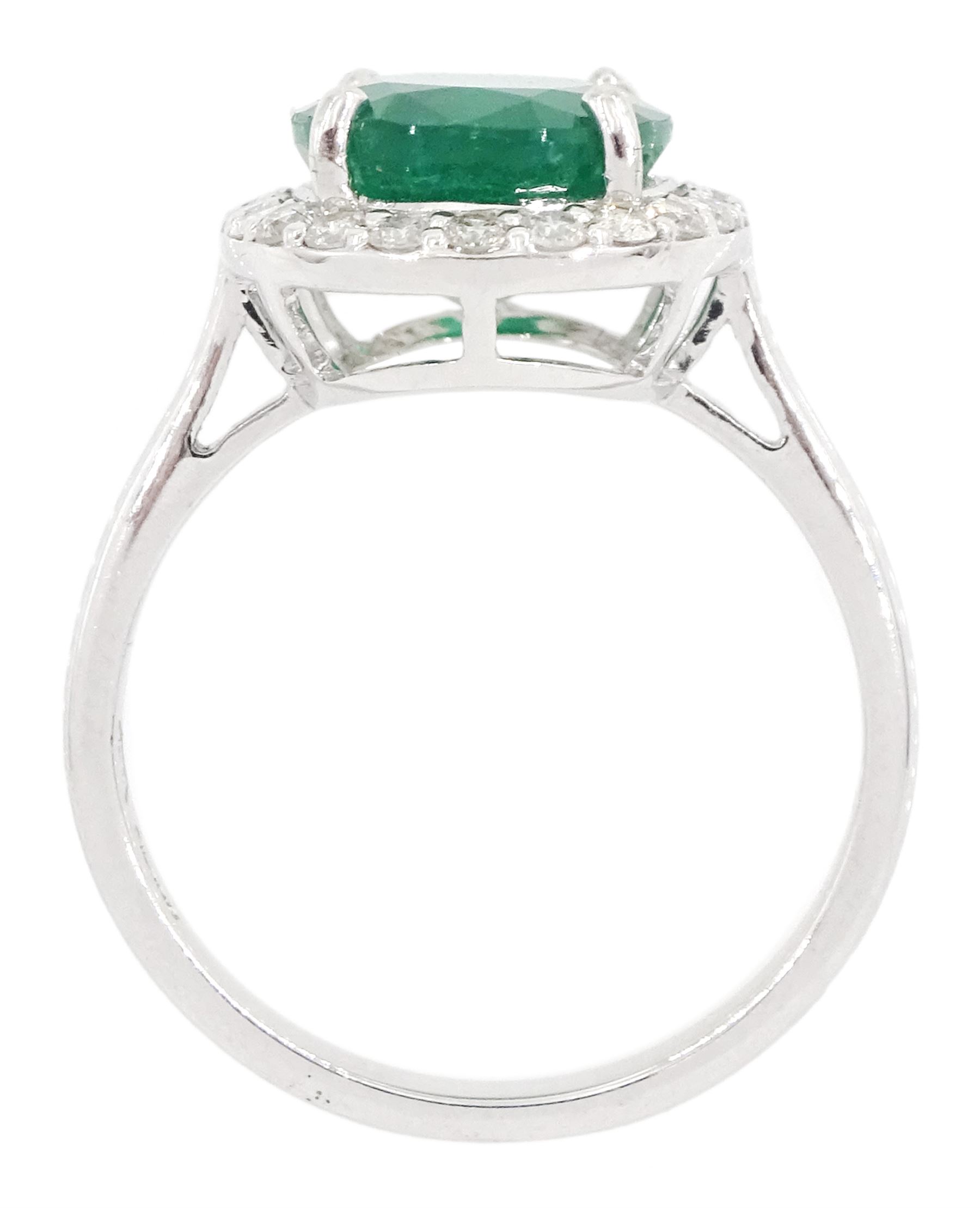 18ct white gold oval cut emerald and round brilliant cut diamond cluster ring, hallmarked, total emerald weight 3.33 carat, total diamond weight 0.40 carat, with World Gemological Institute Report