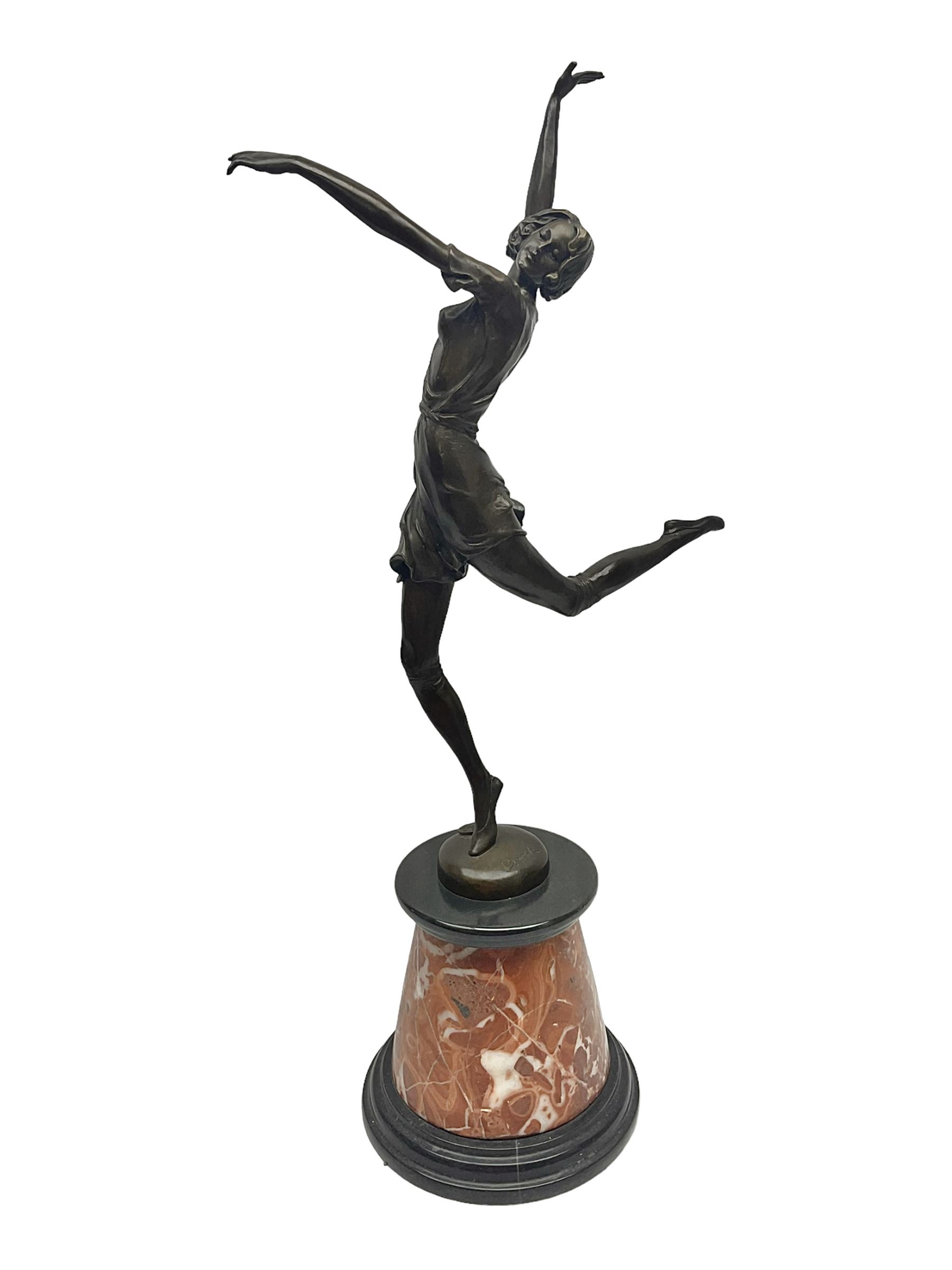 Art Deco style bronze, after Bruno Zach, modelled as a dancer with her arms raised, on a veined marble tapering base signed B. Zach and with foundry seal, H65cm