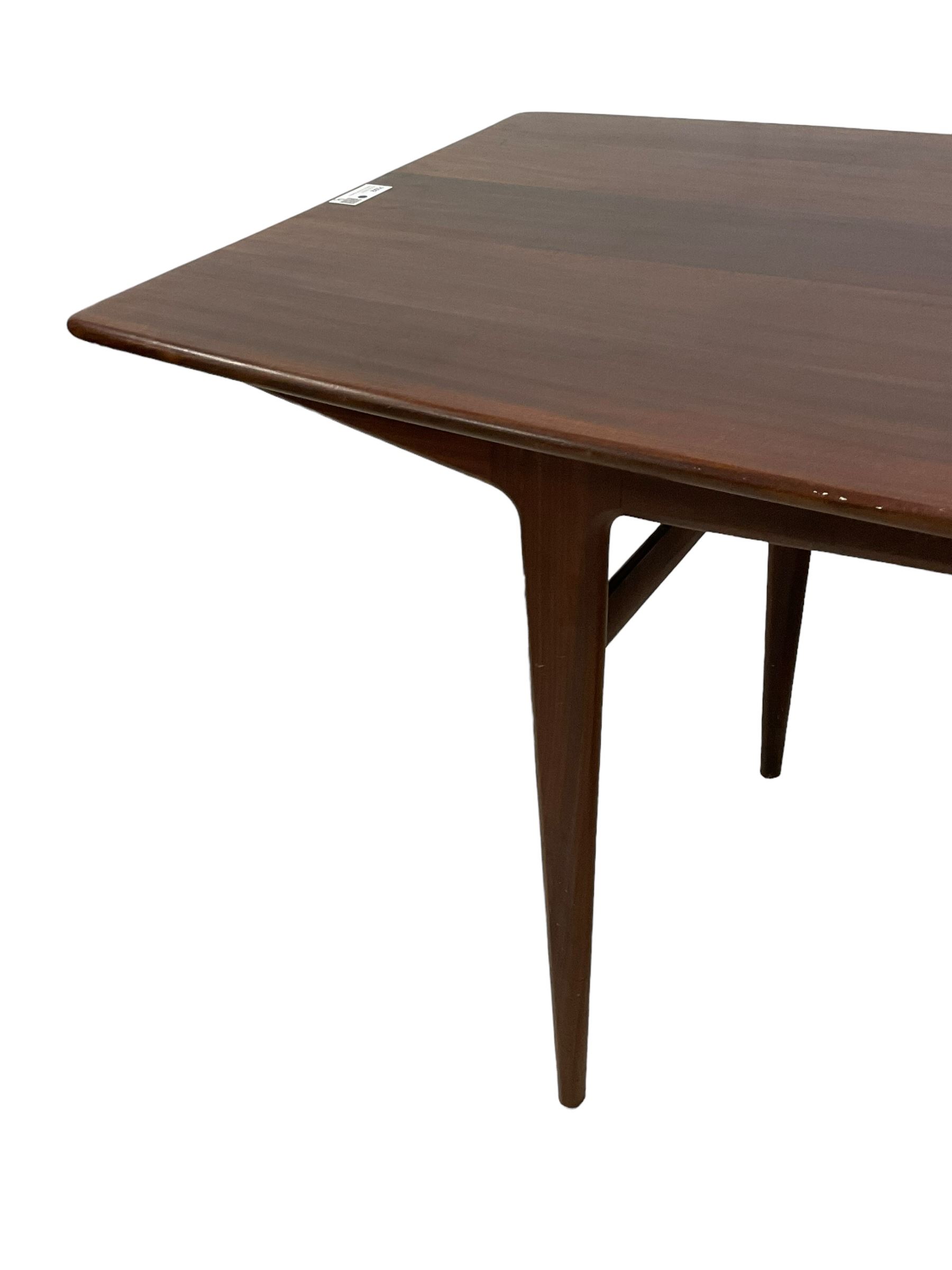 John Herbert for A Younger - mid-20th century teak dining table, curved rectangular top on tapering supports 