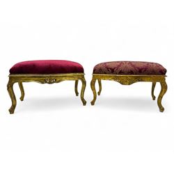 Pair of Louis XV-design giltwood stools, each upholstered in red damask fabric with slight...