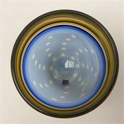 Stuart Akroyd glass vase, yellow banded top and blue lower section with bubble inclusions, with sticker and engraved signature beneath, H17cm