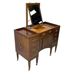 Late 19th century mahogany and satinwood dressing chest, the raised middle section hinges to reveal an interior fitted with lidded compartments, removable tray, single drawer and glass scent bottles, lift-up bevelled mirror with adjustable hinged mechanism, fitted with a further eight cock-beaded graduating drawers and curved kneehole with double cupboard, square tapering supports on brass cups and castors, inlaid throughout with checkered stringing, ornate Rococo cast gilt metal handles