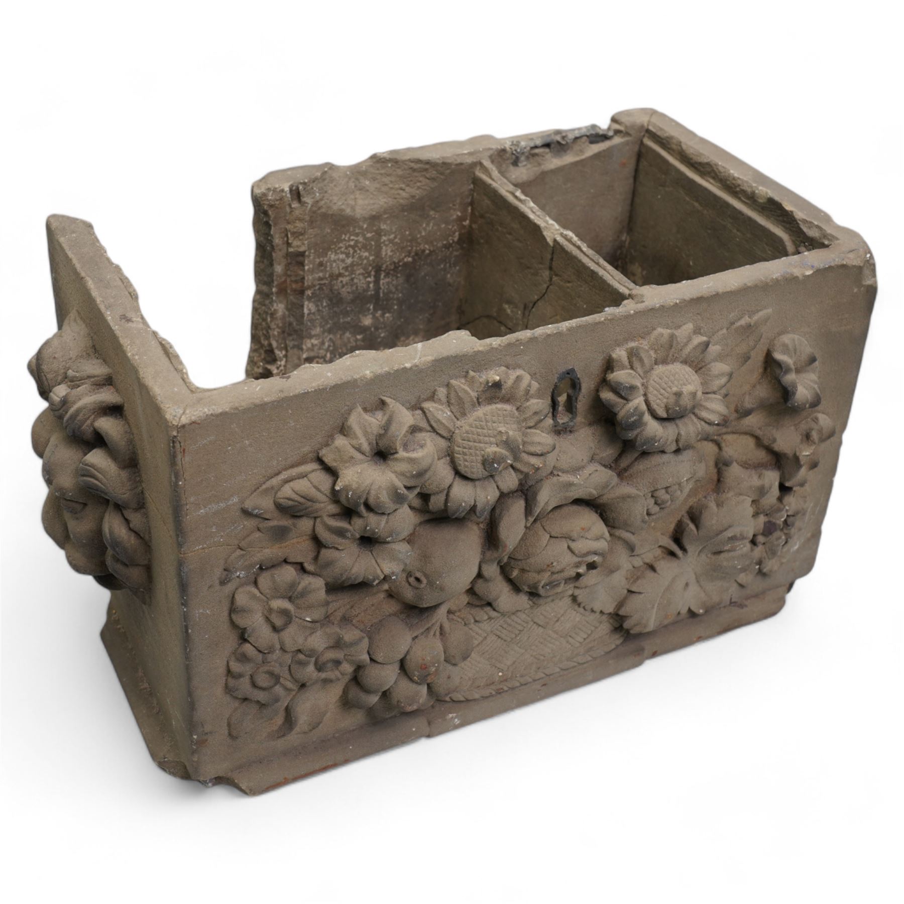 19th century rectangular coade stone casket , the front panel with a spray of flowers, the sides with lion masks 30cm x 15cm x 17cm