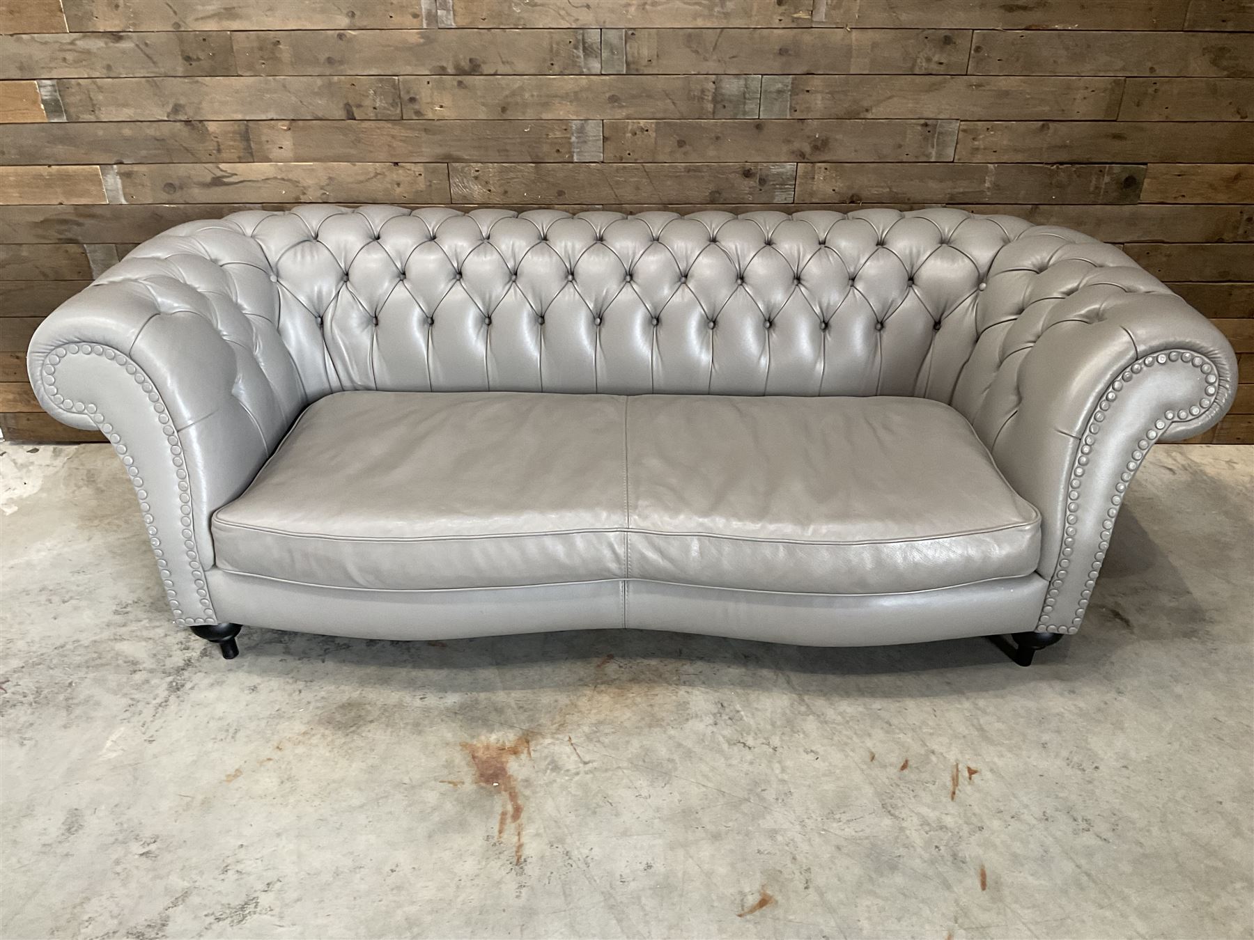 Three seat Chesterfield sofa, upholstered in grey buttoned leather