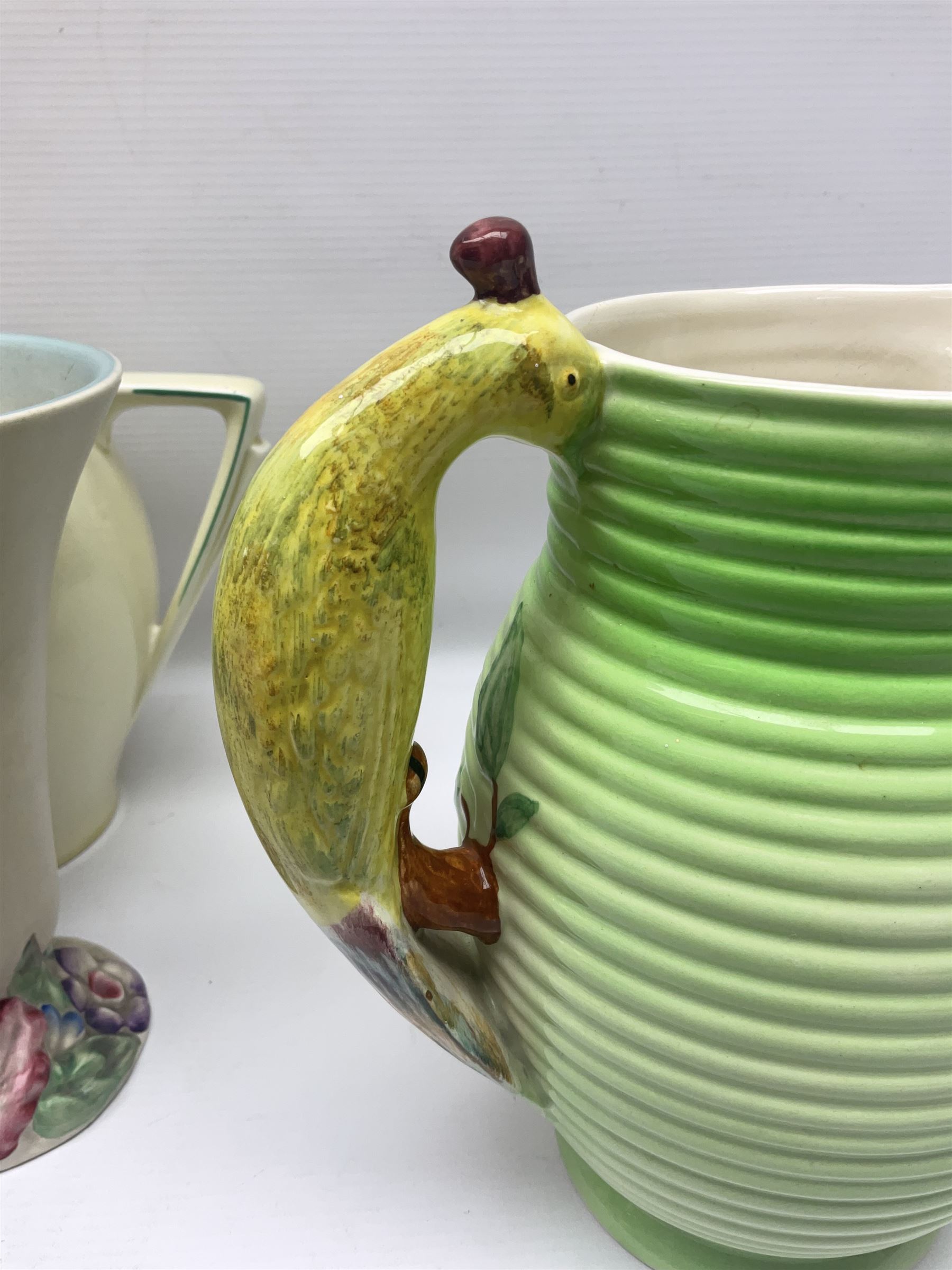 Collection of 1930s ceramics, comprising Shorter & Son jug with bird handle, set of three J.H.W & Sons graduating jugs, Clarice Cliff My Garden pattern vase and Celtic Harvest pattern cake plate and a Burleigh Ware sandwich plate set, bird jug H21cm