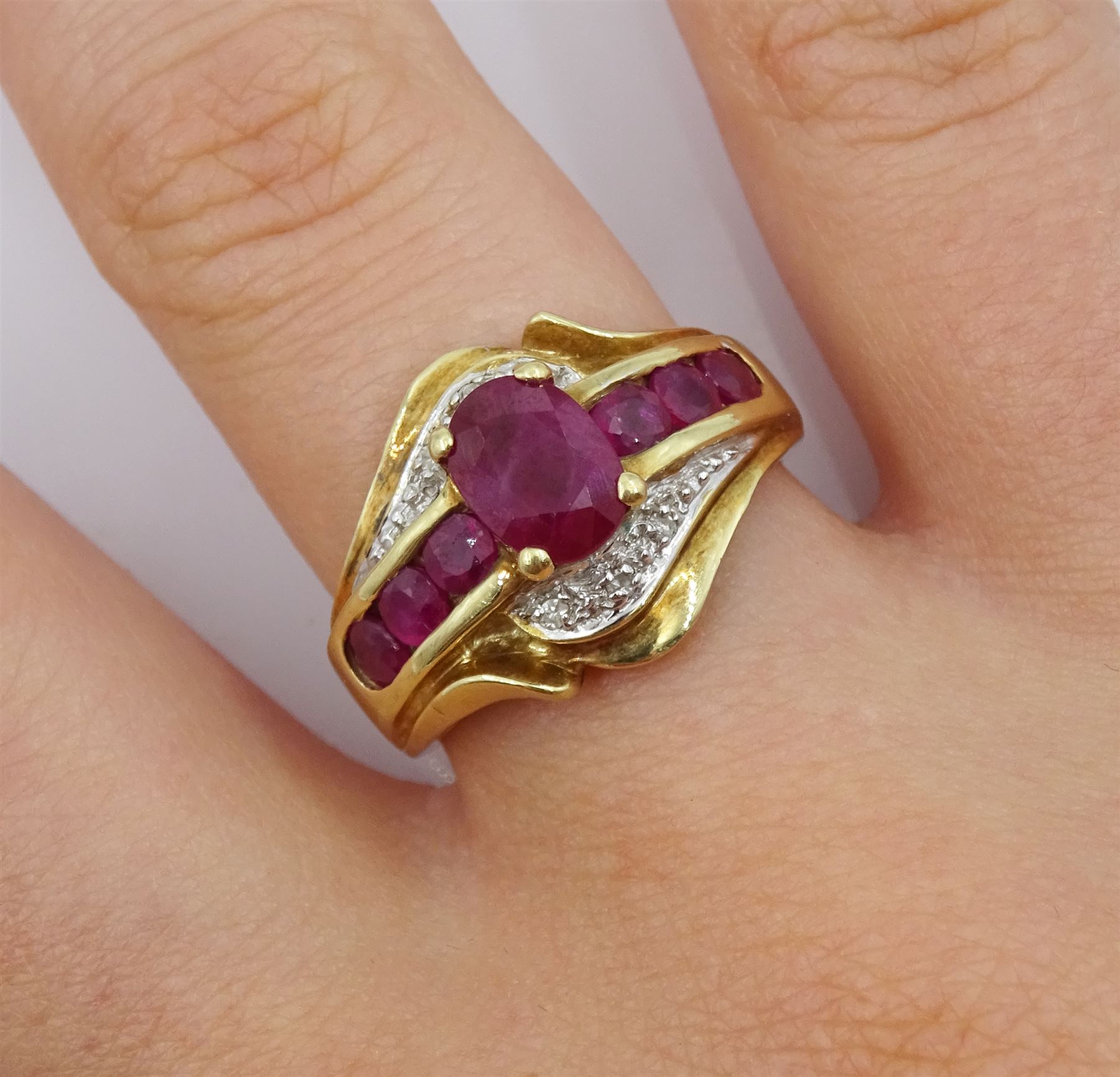 Gold ruby and diamond cluster ring, stamped 10K