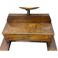 Early 20th century oak vanity stand, with circular adjustable mirror, brass towel rails to the sides, marble inset top and upper compartment, over additional storage compartment with hinged front, on splayed supports with stretchers