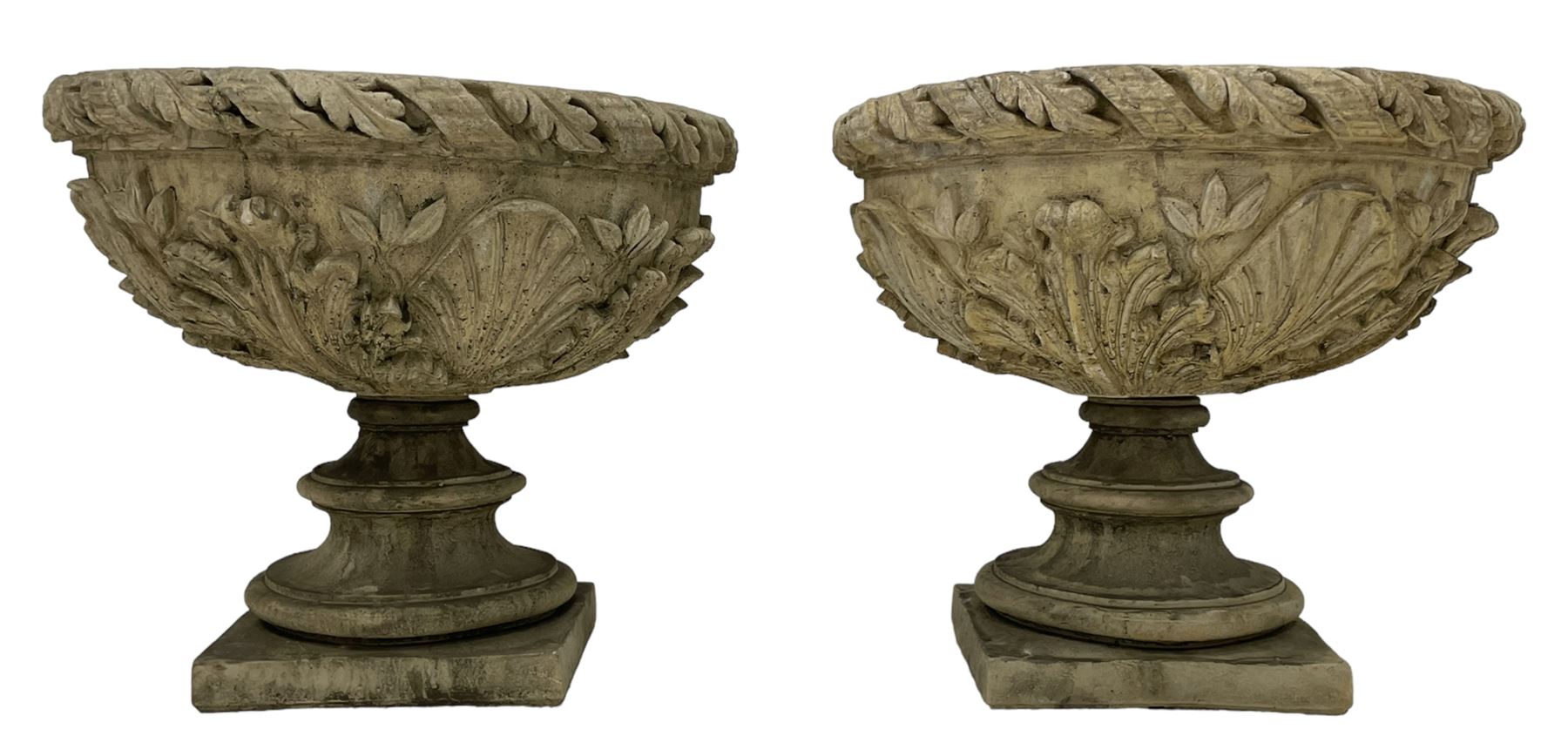 Pair of composite stone garden urn planters, acanthus leaf garland rim over foliate decorated body, stepped foot on square base