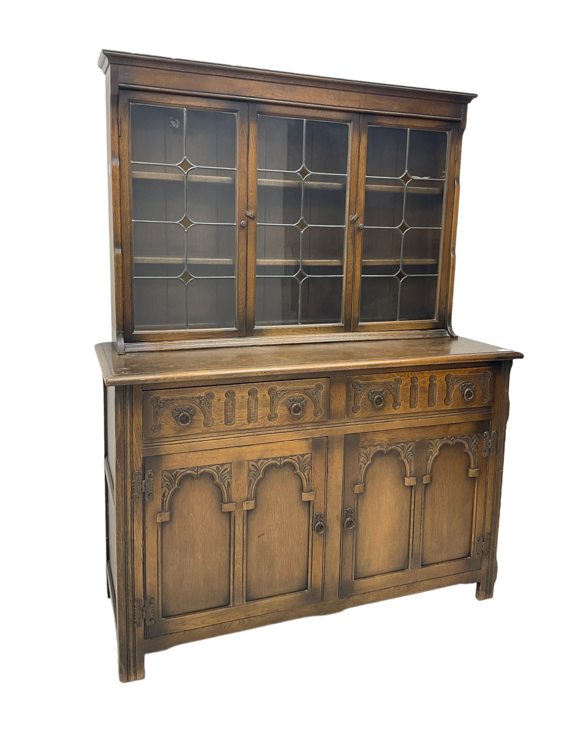 Mid-20th century oak dresser, raised back enclosed by three lead glazed doors, fitted with two drawers and two cupboards