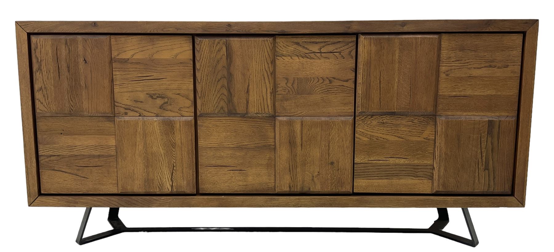 Samba 'Camden' oak sideboard, rectangular top over three block panelled cupboard doors, raised on angled black metal supports connected with stretcher