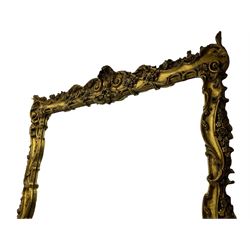 Large gilt framed rectangular wall mirror, shaped and moulded frame decorated with trailing curled acanthus leaves and flower head motifs, bevelled glass plate 