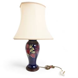 Moorcroft baluster form table lamp decorated in the Anemone pattern, on blue ground, with shade, H36cm excluding fitting