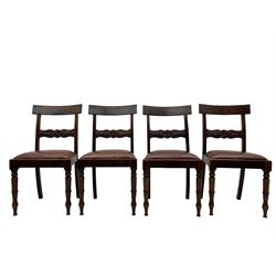 Set of six (4+2) early 19th century mahogany dining chairs, figured bar back over rose and curled leaf carved middle rail, drop-in seats upholstered in brown fabric, on turned front supports 