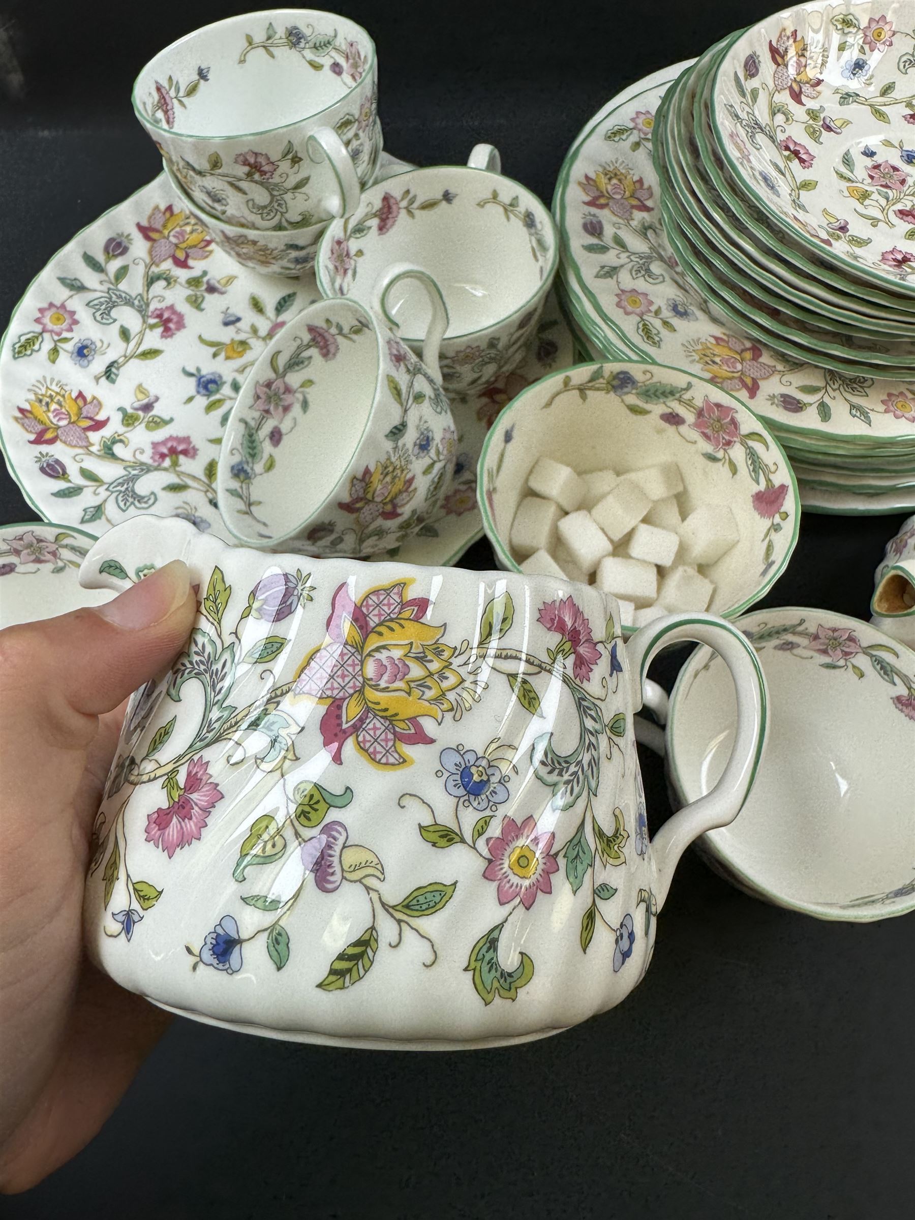 Minton Haddon Hall pattern part tea service, including milk jug, open sucrier, teacups and saucers, dessert plates etc