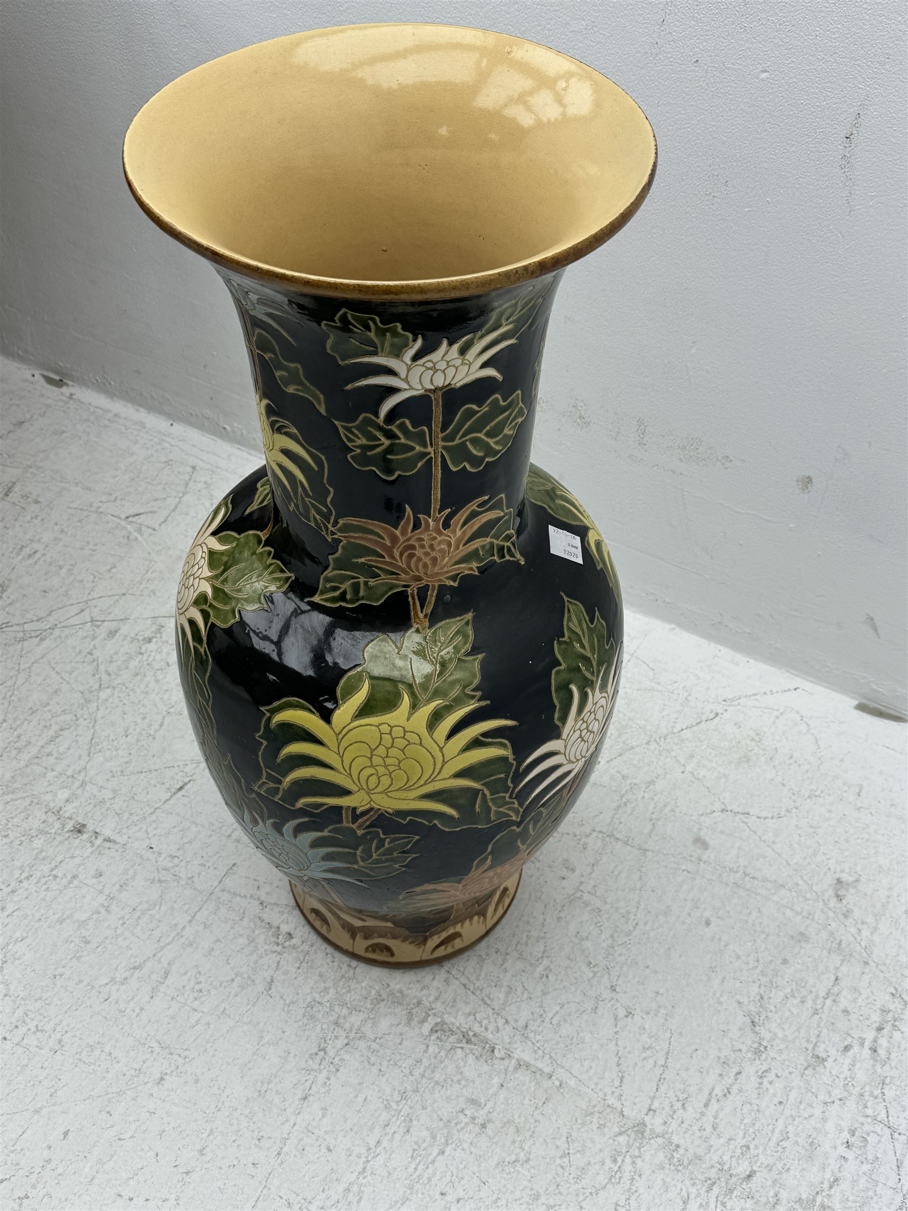 Floor vase with stylised flowers on a black ground, H84cm