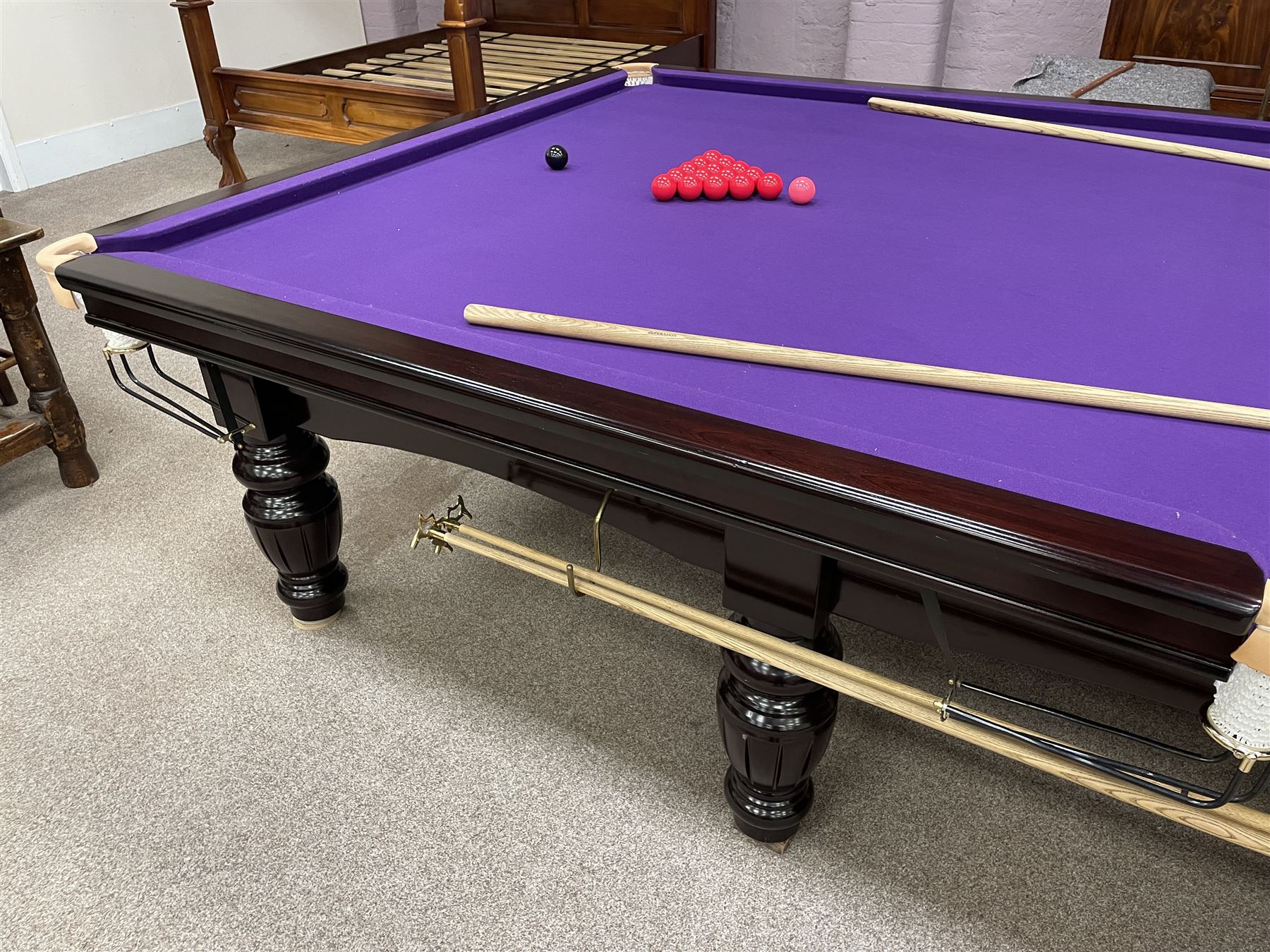 Riley - full-sized 12' x 6' slate bed snooker table, mahogany frame with purple baize, raised on turned and fluted baluster supports, recently refurbished; together with, cues, scoreboard, cover, snooker and pool balls