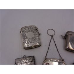 1920s silver miniature purse, engraved with triskelion symbol to hinged cover, hallmarked Adie & Lovekin Ltd, Birmingham 1920, together with five early 20th century silver vesta cases, all of typical form, engraved with foliate and scrolling details, all hallmarked