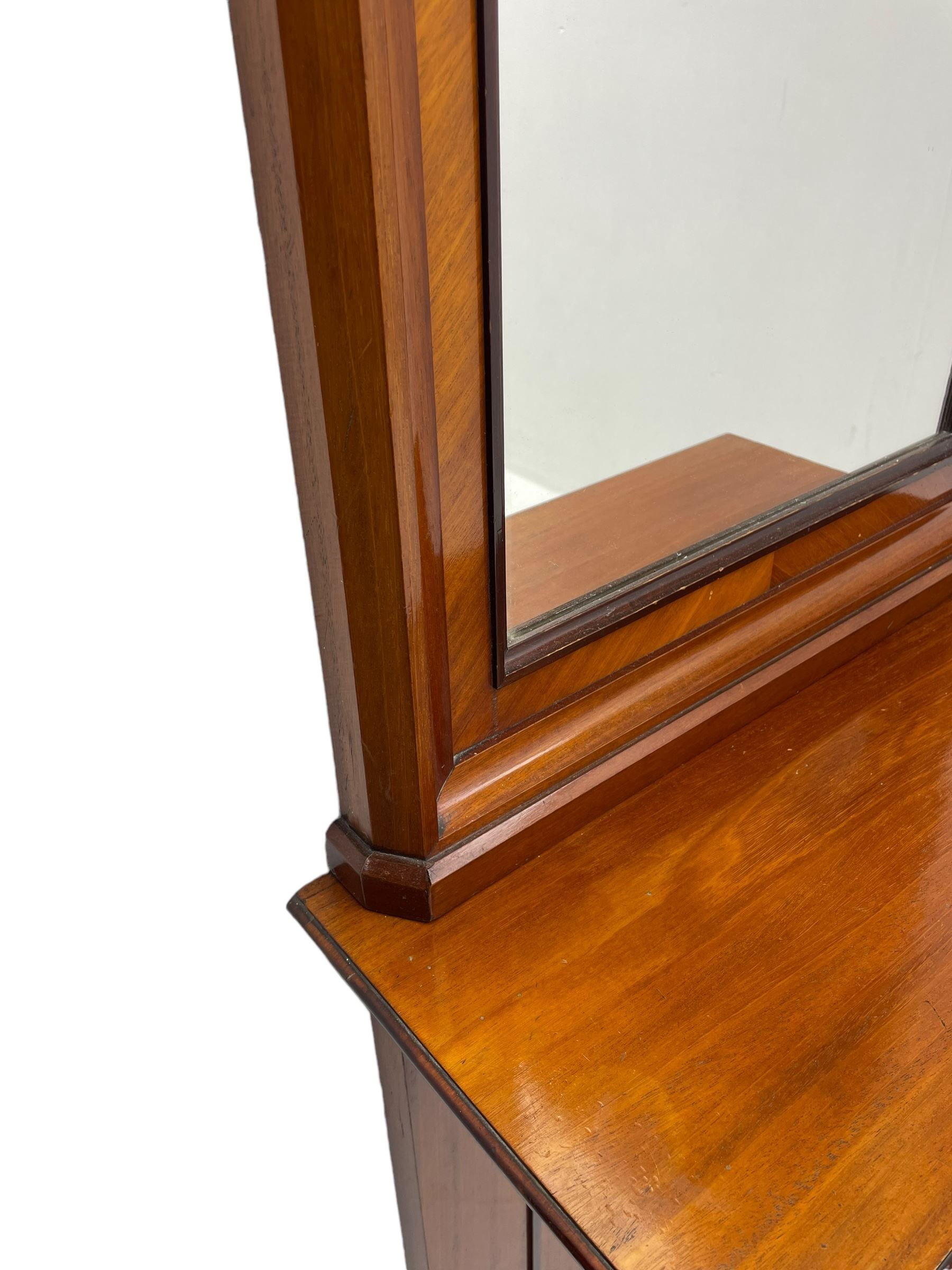 Late 19th to early 20th century walnut hallway console table with pier mirror, tall rectangular mirror with ovolo-moulded cornice, plain mirror plate surrounded by moulded slip and crossbanding, rectangular top over panelled back supports by turned supports, on sledge feet 