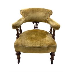 Victorian pair of mahogany armchairs, upholstered in gold velvet fabric, each with curved back, pierced splat and scroll arms, one with rounded seat and the other square, on turned front supports with castors