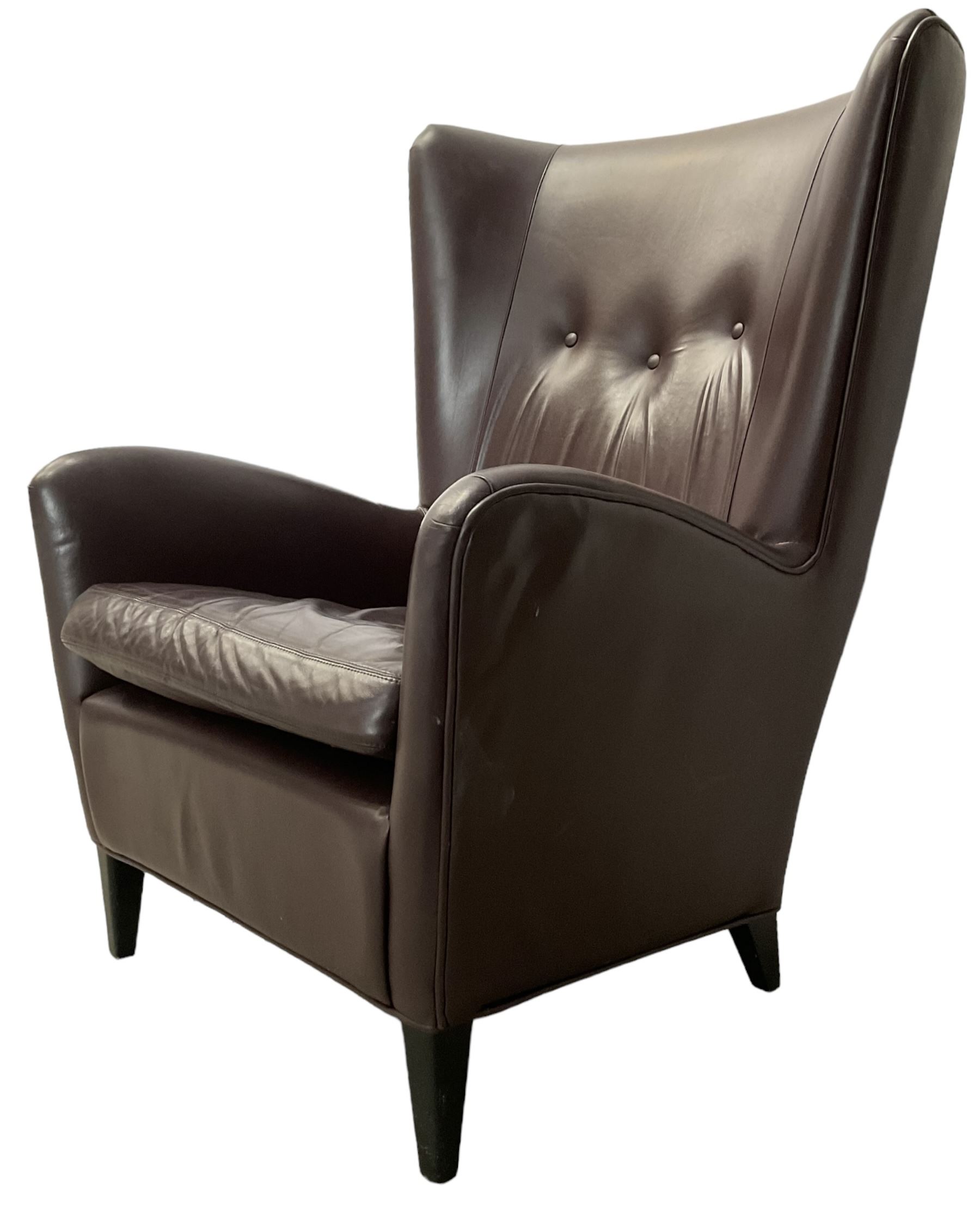 Wing back armchair upholstered in cocoa brown leather