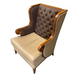 Walnut finish framed wing back armchair upholstered leather and buttoned fabric