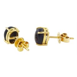 Pair of gold black / brown star sapphire stud earrings