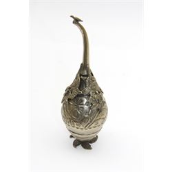 Egyptian white metal rosewater sprinkler, the pear shaped body embossed with flowers, the screw top with applied rose and bird decoration, upon foliate base, H20cm