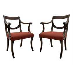 Set of six (4+2) George III design mahogany dining chairs, curved reed moulded bar back over curved and reeded middle rail, upholstered in red fabric with repeating pattern, on moulded sabre supports 