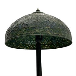 In the manner of Tiffany & Co. - bronze 'Chased Pod' design floor lamp, 'Maple Leaf' dome leaded glass shade decorated with flowers in blue and green shades, six branches on column decorated with stylised trailing stems terminating to circular base with stylised plant decoration, on scrolled feet, the base stamped 'Tiffany Studios New York 379' the inner shade stamped 'Tiffany Studios New York [...]'