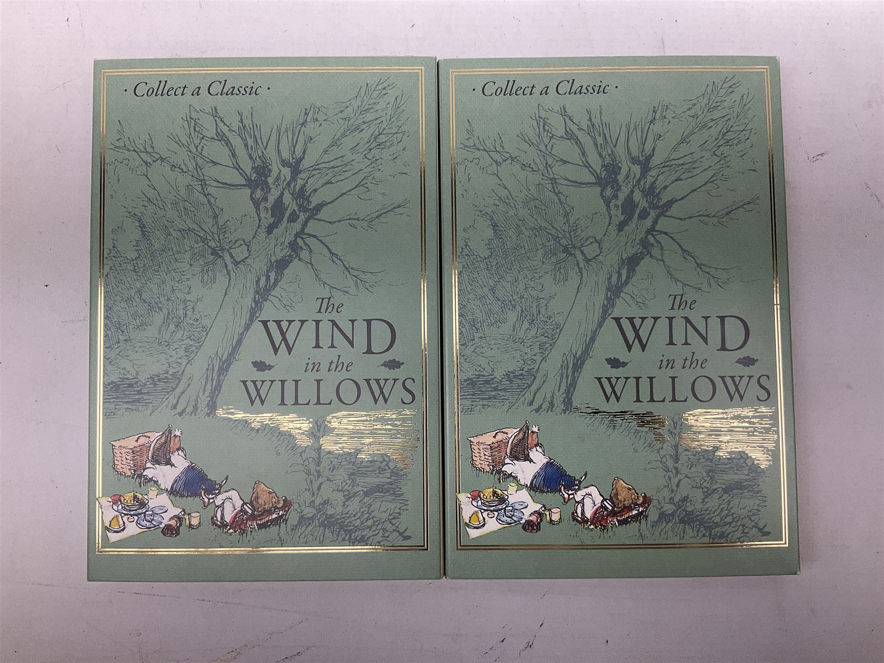 Two Queen Elizabeth II Ascension Island 2021 Wind in the Willows seven coin sets, both with 'Toad's Last Little Song' 24ct gold fifty pence weighing 2.25 grams, includes both layered in pure silver and fine .999 silver fifty pence pieces, housed in a presentation folders with certificates