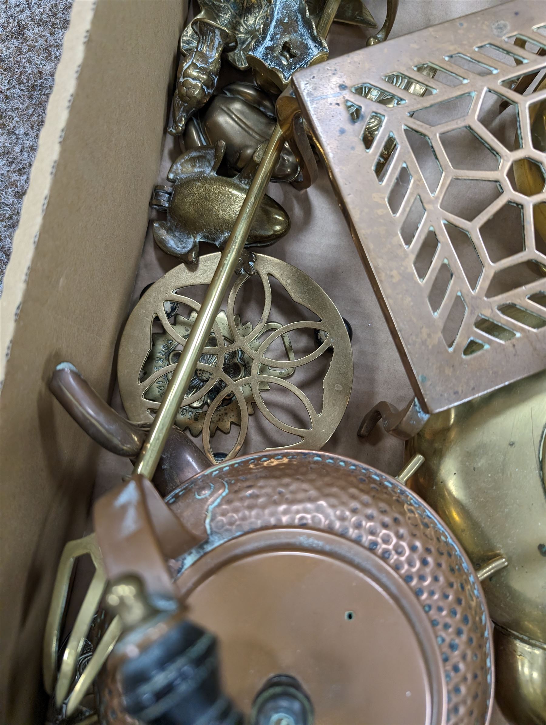 Copper and brassware, including three kettles, trivets and novelties