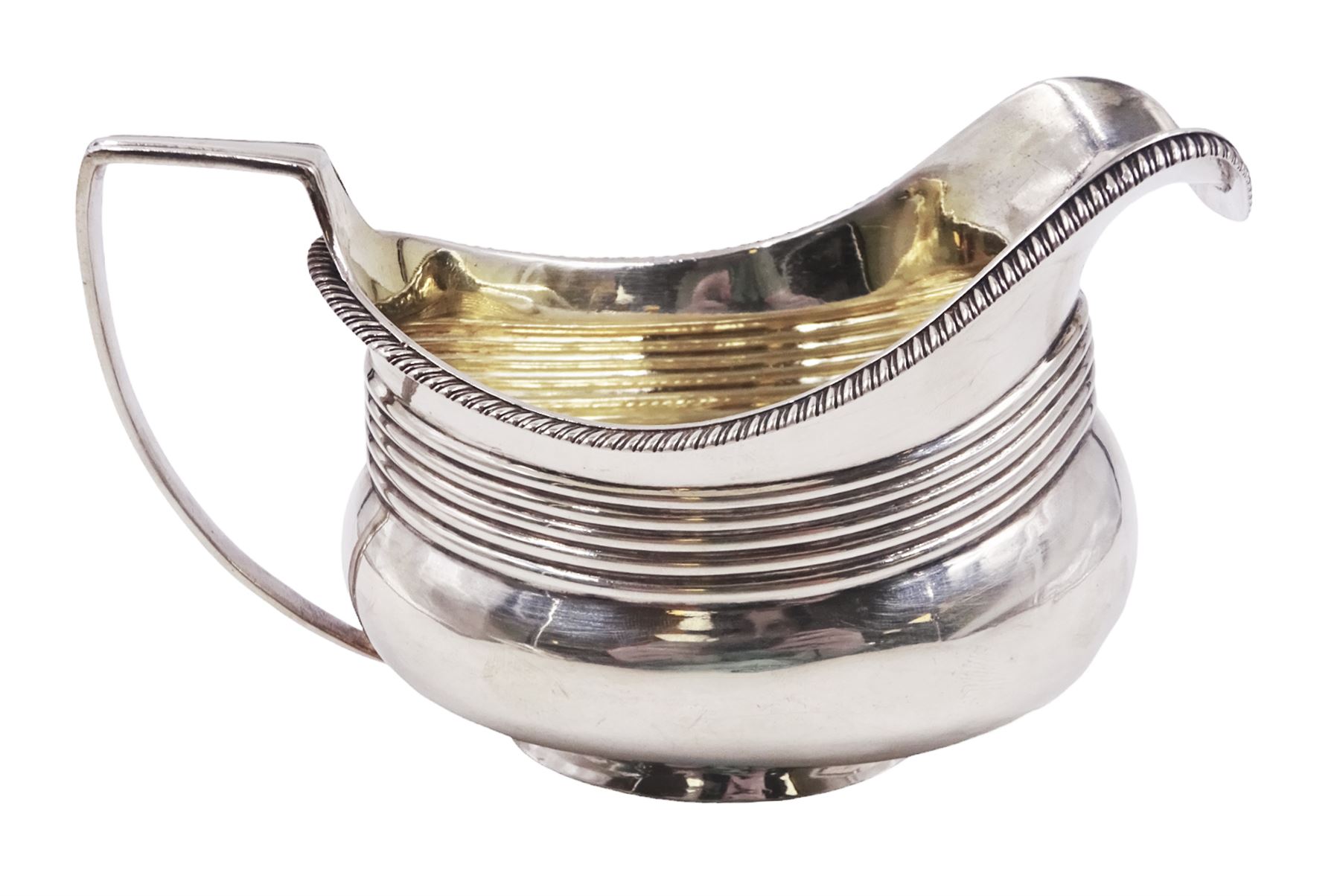 George III silver jug, of oval form with oblique gadrooned rim and band of ribbed decoration, hallmarked Michael Starkey, London 1808, H7.5cm