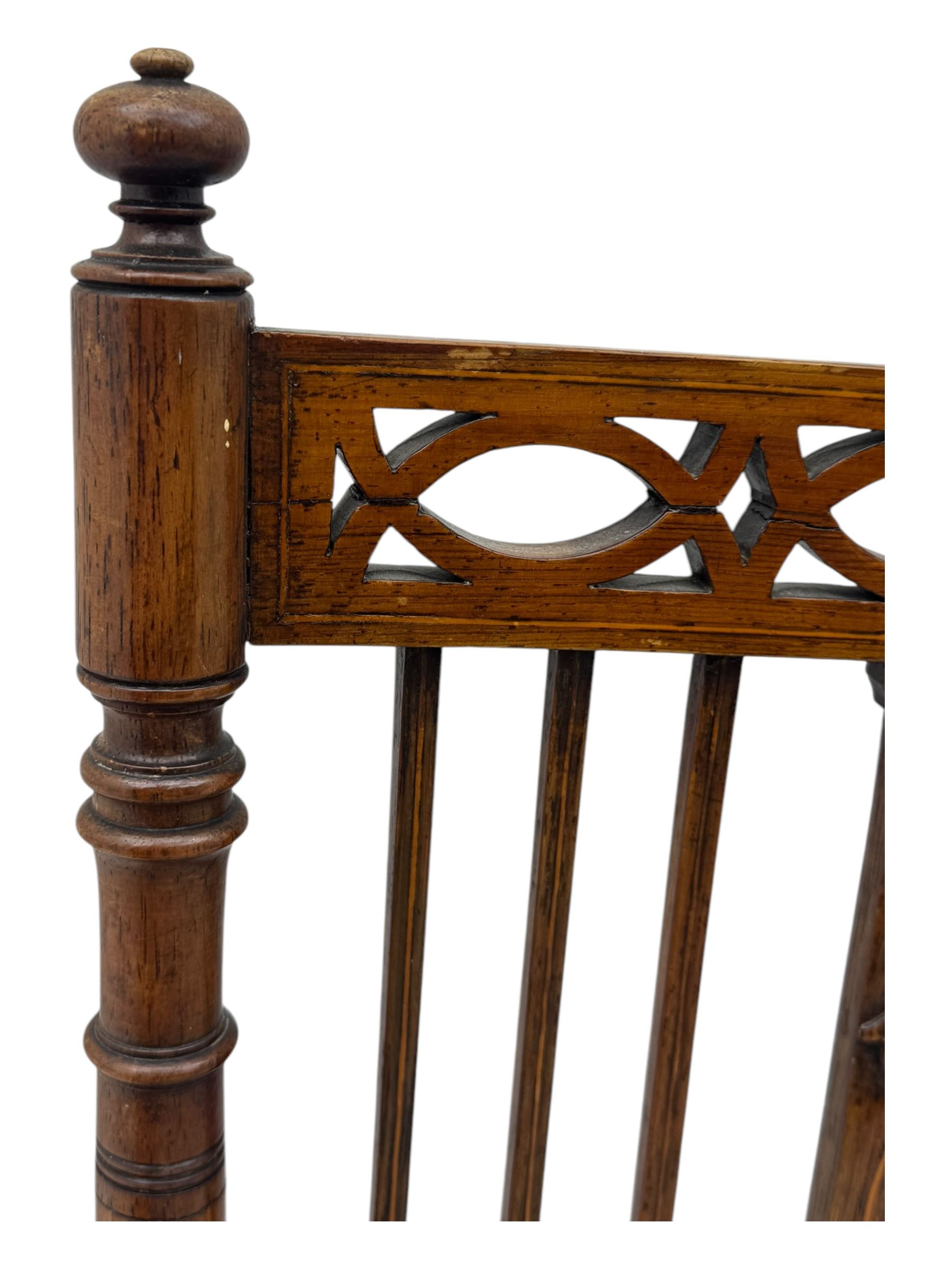 Edwardian inlaid rosewood elbow chair, pierced cresting rail over carved ribbon tie and oval inlaid panel, upholstered in stripe and floral pattern fabric, on square tapering supports with spade feet 