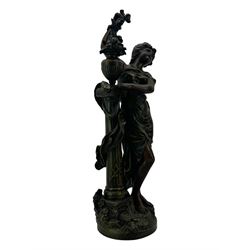 After L & F Moreau - Spelter table lamp in the form of a female figure next to a pedestal on circular naturalistic base H55cm