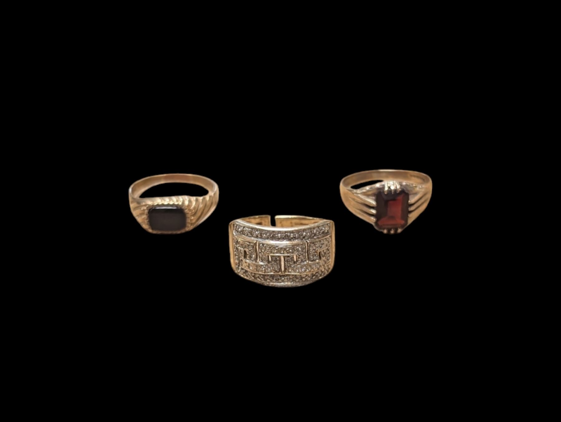 Three 9ct gold stone set rings, including diamond cluster ring, onyx ring and garnet ring, all hallmarked 