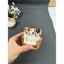 Two Royal Doulton figures of puppies in baskets, together with Beswick horse and other animal figures