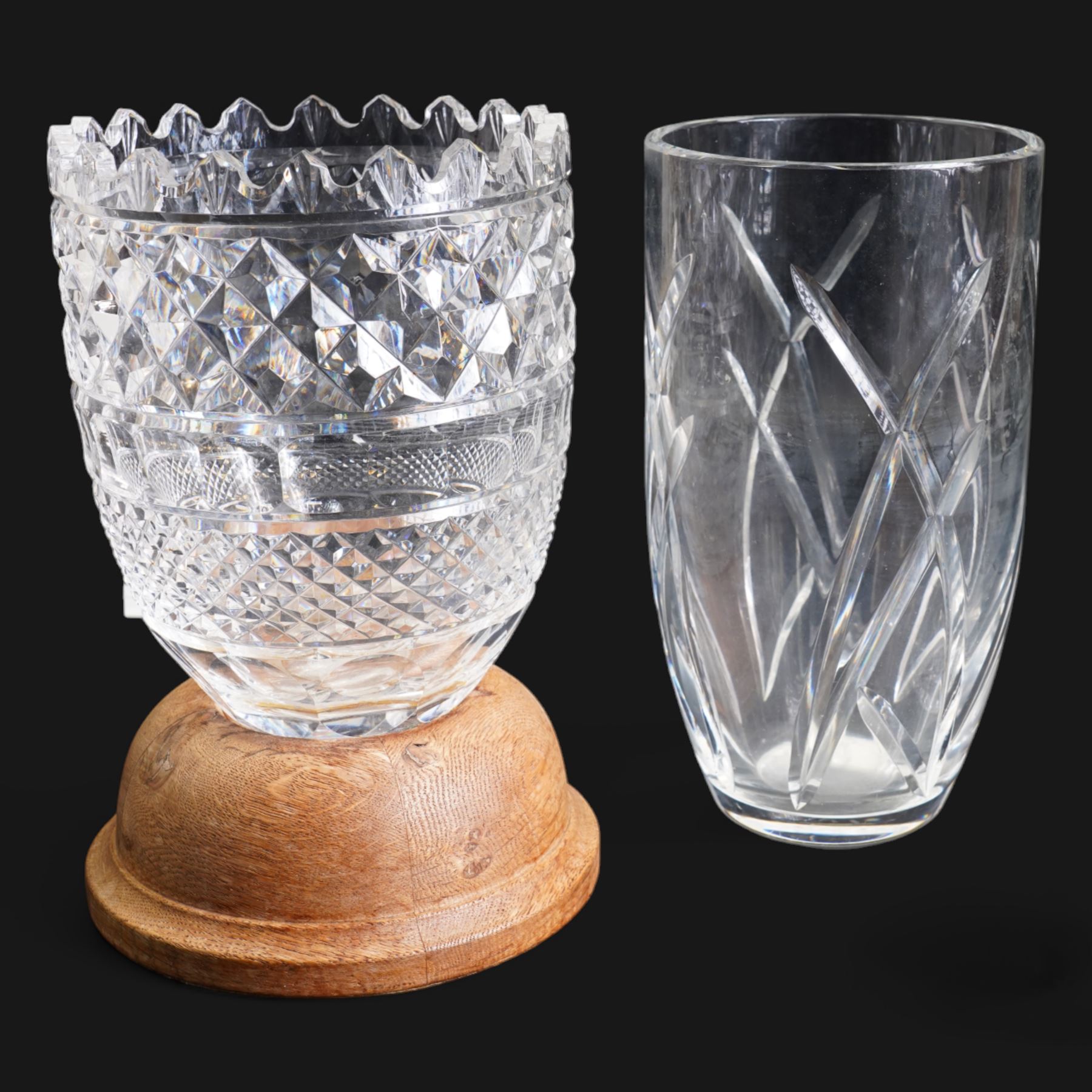 Large Waterford crystal vase, on replacement turned oak stand, H26.5cm, together with a John Rocha for Waterford crystal vase, H25.5cm (2)