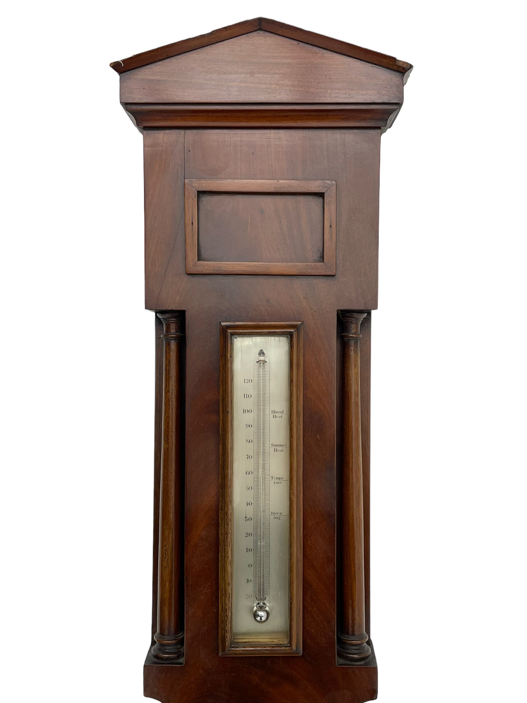 McDowall of Edinburgh - mid-Victorian mahogany mercury wheel barometer, with a gable pediment and cavetto moulded square base, cast brass bezel enclosing a 10-inch silvered register with an engraved symmetrical pattern to the centre and barometric air pressure in inches, boxed mercury thermometer with a silvered Fahrenheit scale flanked by turned wooden pilasters, brass recording hand button, rectangular spirit level signed McDowall, Edinburgh.
This barometer once formed part of the collection of Edwin Banfield, a leading authority on barometers and is illustrated in his book 