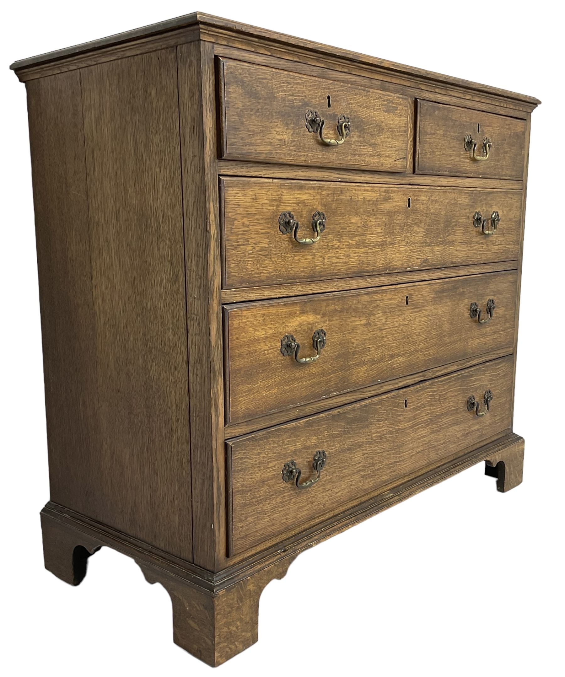 Early 20th century Georgian design oak chest, fitted with two short over three long drawers, lower moulded edge over bracket feet