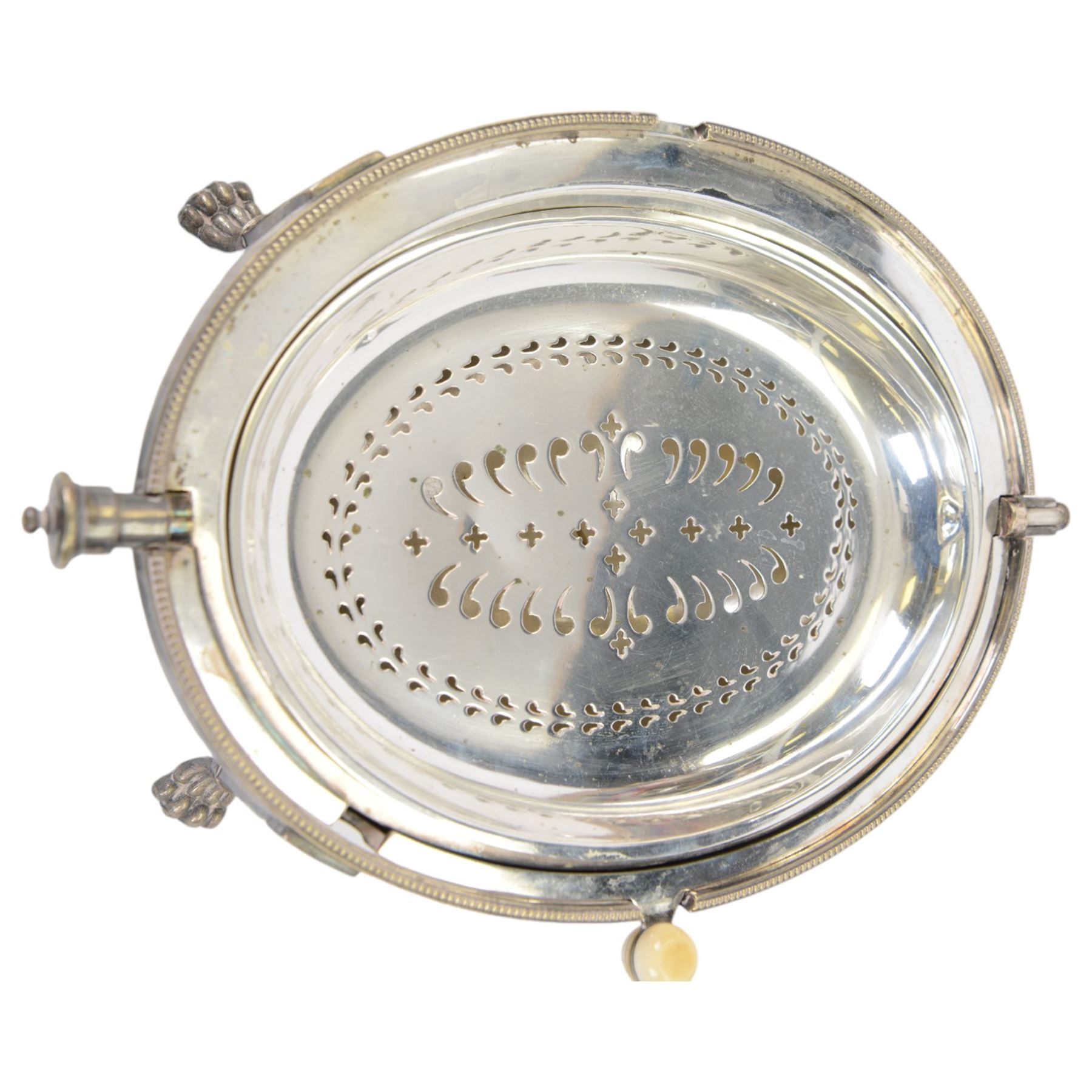 Walker and Hall turnover dish, engraved throughout with foliate decoration, with ivorine handle and upon four paw feet, together with a pair of silver plated candelabra and a pair of silver plated candlesticks, tallest H20cm